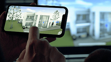 Smartphone zeigt Gebäudemodell 